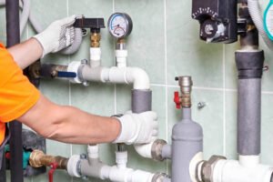 A Plumber Checking a Commercial Heating System